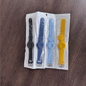 New! Set of 4 Silicone Air Tag Holder Bands in Black, Navy, Light Blue & Yellow